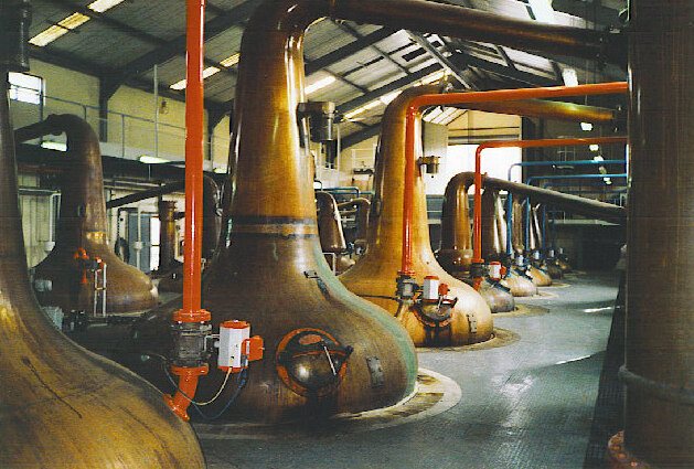 Copper swan-necked pot stills inside Glenfiddich Distillery