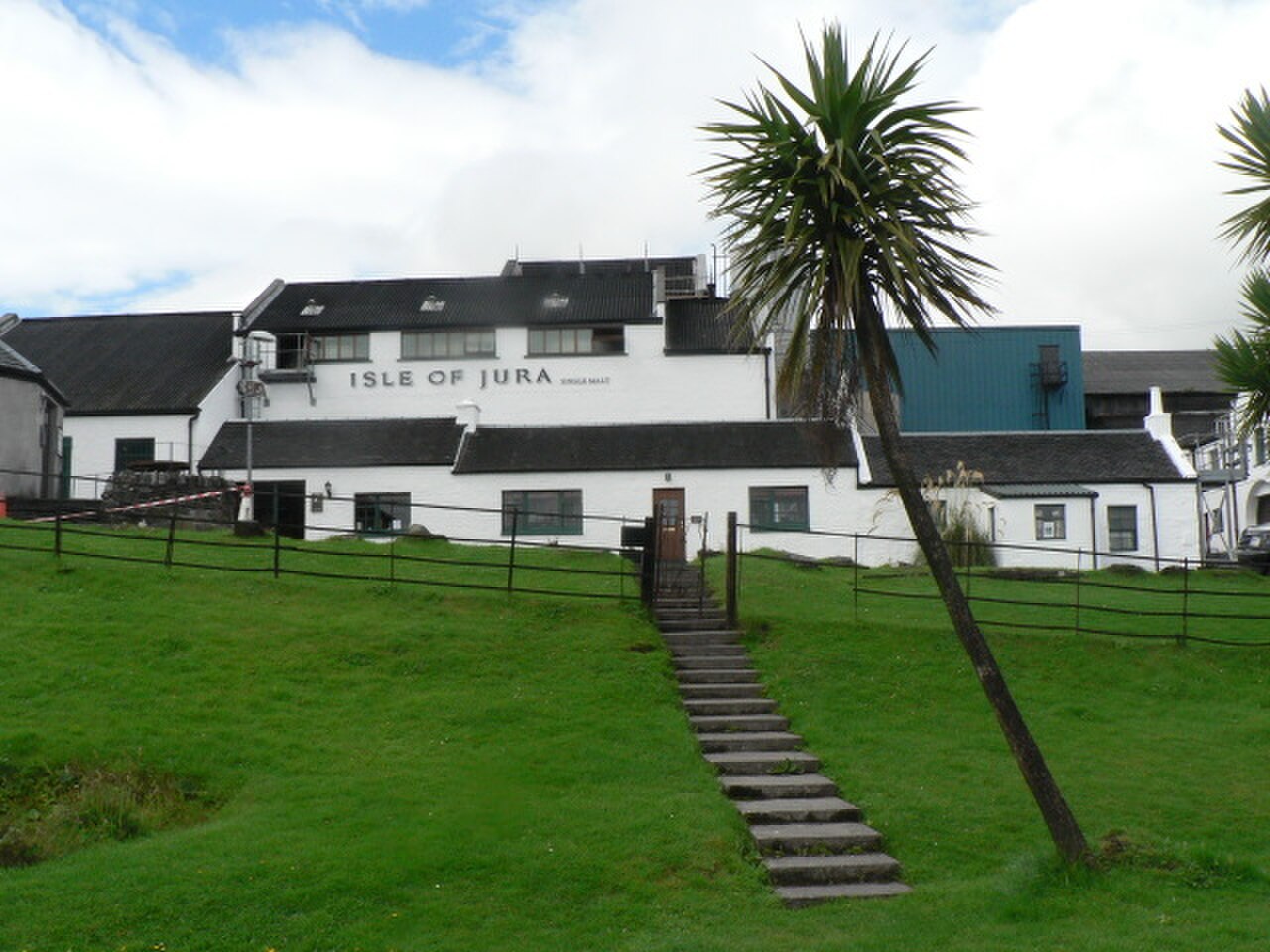 Exterior of Jura Distillery buildings in Craighouse on the Isle of Jura, viewed from the surrounding settlement.