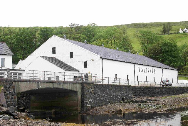 Talisker Distillery buildings at Carbost on the Isle of Skye, viewed from the Loch Harport side.